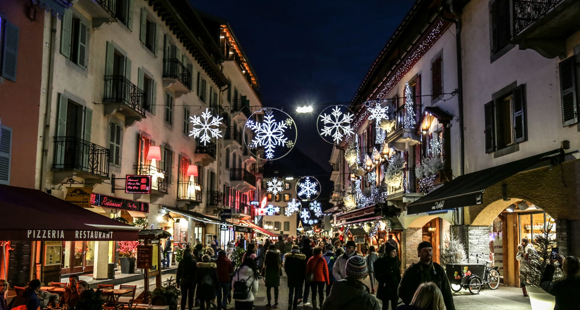 Shoppers walking through Chamonix during christmas