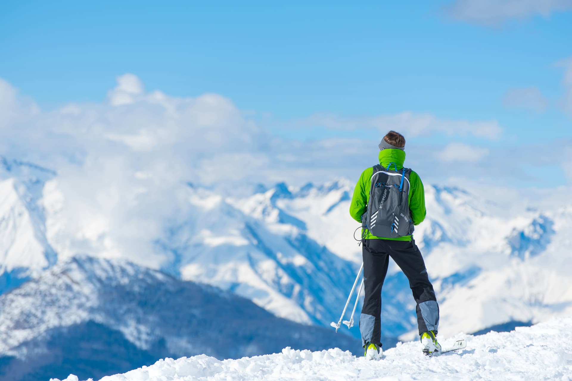 man-standing-on-top-of-snow-mountain