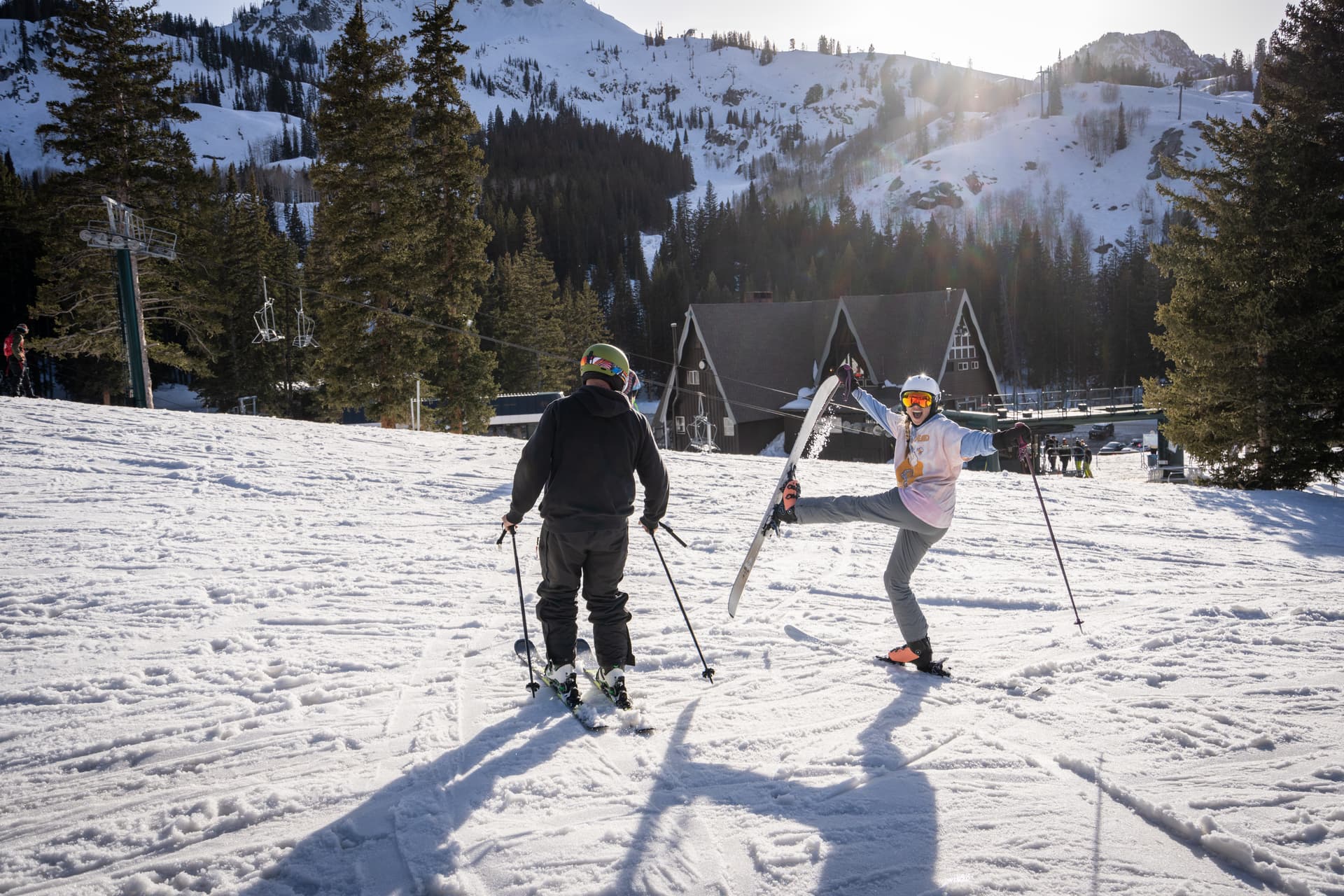 Friends having fun skiing and posing for photo